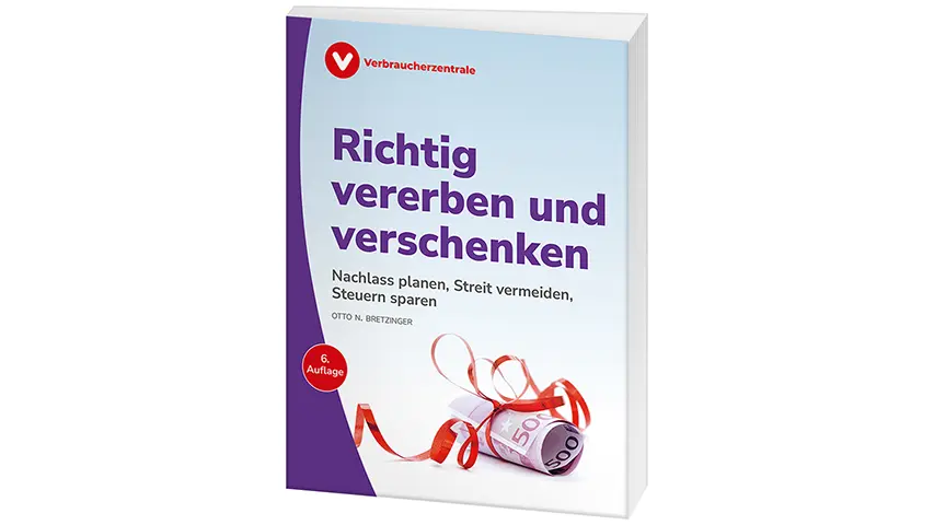 Gerollter 500 Euro Schein, mit einem roten Geschenkband umwickelt