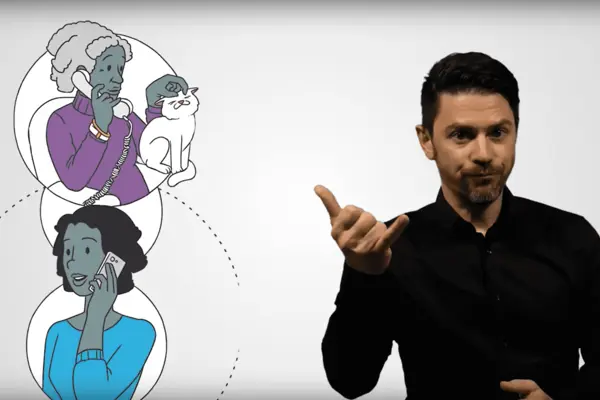 Ein Mensch übersetzt ein Video in Gebärdensprache.