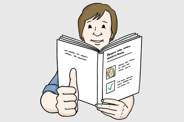 Eine Person hält ein Buch in der Hand und zeigt mit der rechten Hand Daumen hoch.
