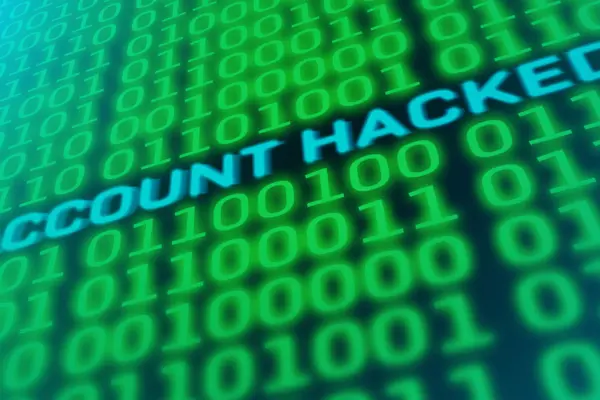 Das Bild zeigt einen Computerbildschirm mit dem Schriftzug "Account hacked" inmitten angeordneter Einsen und Nullen