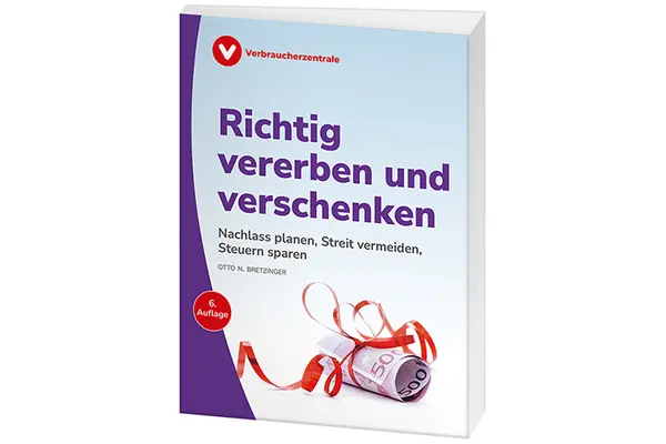 Gerollter 500 Euro Schein, mit einem roten Geschenkband umwickelt