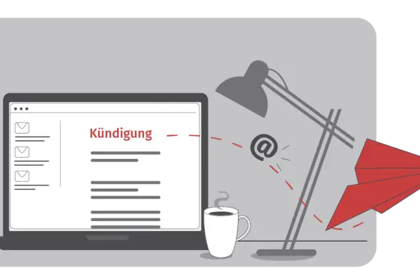 Auf einem Laptop wird eine E-Mail mit der Aufschrift "Kündigung" angezeigt