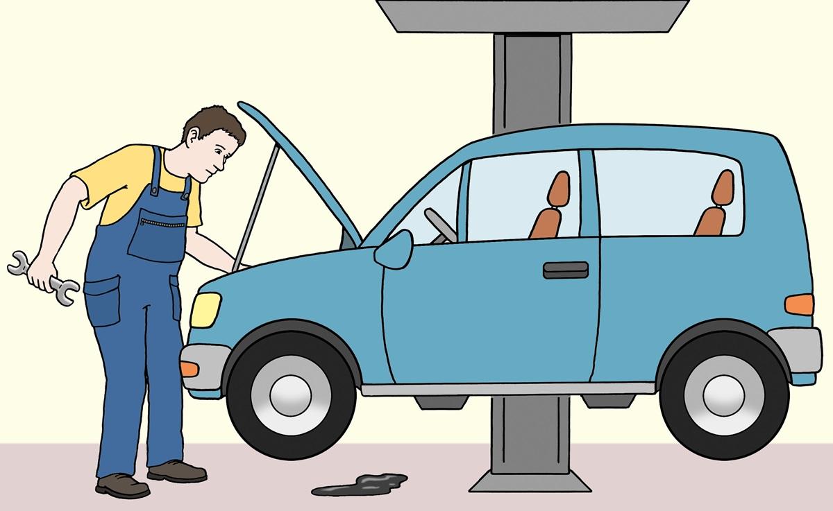 KFZ-Werkstatt: Mann schraubt an einem Auto