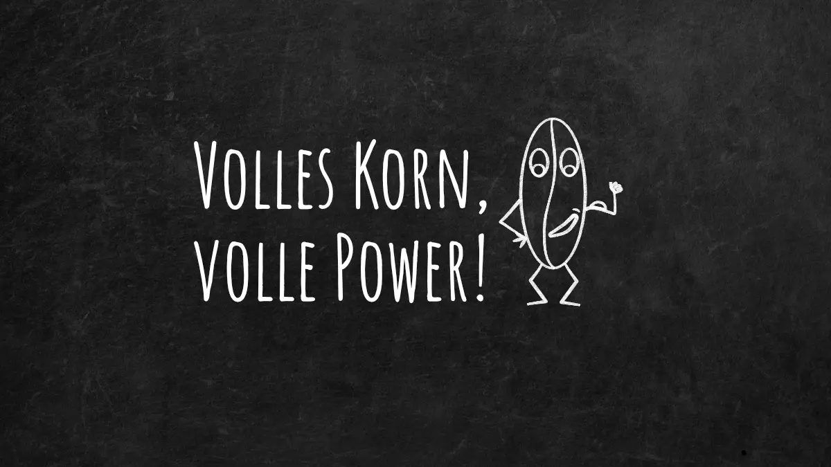 Schwarze Tafel auf der mit Kreise geschrieben ist: Volles Korn, volle Power. Daneben ist eine Comiczeichnung mit weißer Kreise von einem Getreidekorn.