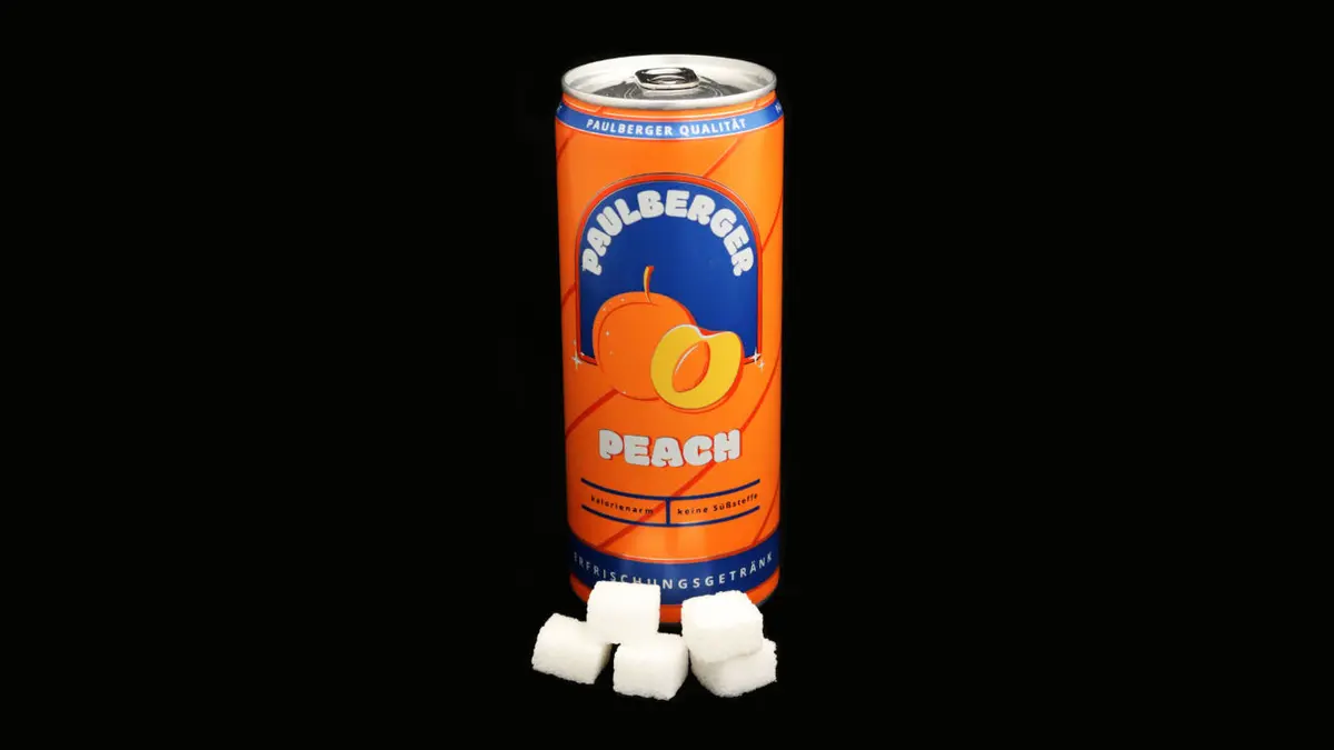 Dose Paulberger Peach auf schwarzem Grund mit 5 Zuckerwürfeln davor