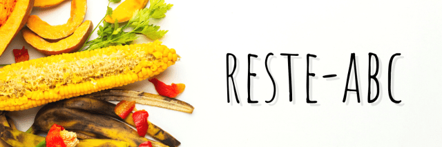 Reste und Schalen von Gemüse, daneben Reste-ABC Schrift